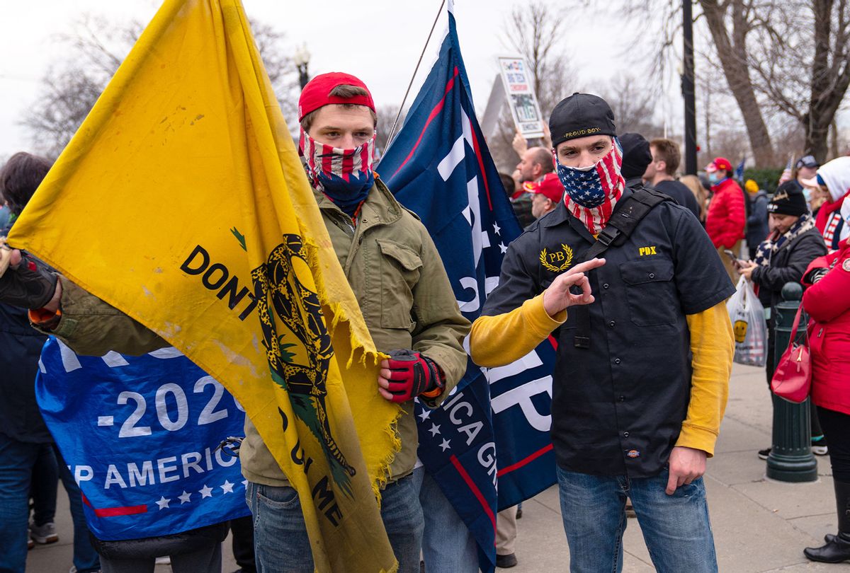 Members of the Proud Boys stand for their picture near the U.S. Supreme Court Building during a rally supporting President Donald Trump on January 5, 2021 in Washington, DC. Today's rally kicks off two days of pro-Trump events fueled by President Trump's continued claims of election fraud and a last-ditch effort to overturn the results before Congress finalizes them on January 6. (Robert Nickelsberg/Getty Images)