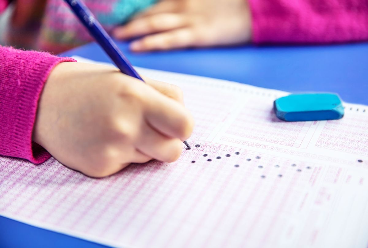 A student filling out a testing sheet (Getty Images)