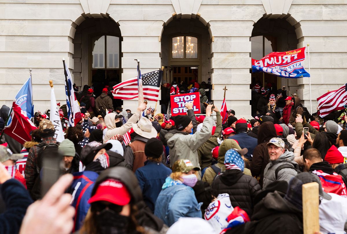 A pro-Trump mob floods into the Capitol Building after breaking into it on January 6, 2021 in Washington, DC. A pro-Trump mob stormed the Capitol, breaking windows and clashing with police officers. Trump supporters gathered in the nation's capital today to protest the ratification of President-elect Joe Biden's Electoral College victory over President Trump in the 2020 election. (Jon Cherry/Getty Images)