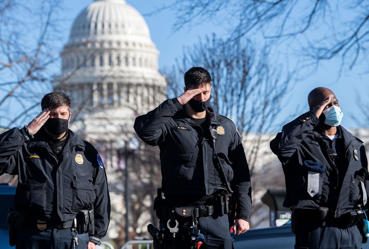 U.S. Capitol Police officers salute as a hearse carrying the body of Officer Brian D. Sicknick, who was killed by rioters Wednesday, passes members of the Capitol and Metropolitan police during a procession on Third Street on Sunday, January 10, 2021. (Tom Williams/CQ-Roll Call, Inc via Getty Images)