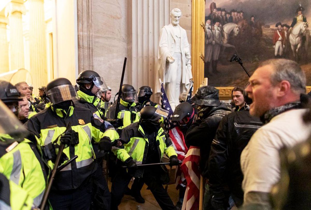Police intervene in US President Donald Trump's supporters who breached security and entered the Capitol building in Washington D.C., United States on January 06, 2021. Pro-Trump rioters stormed the US Capitol as lawmakers were set to sign off Wednesday on President-elect Joe Biden's electoral victory in what was supposed to be a routine process headed to Inauguration Day. (Mostafa Bassim/Anadolu Agency via Getty Images)