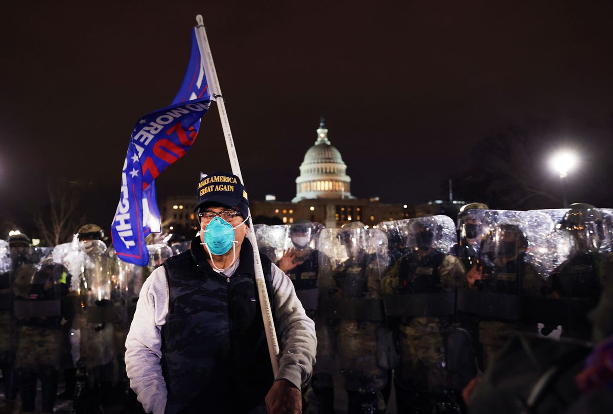 Members of the National Guard and the Washington D.C. police keep a small group of demonstrators away from the U.S. Capitol on January 06, 2021 in Washington, DC. A pro-Trump mob stormed the Capitol earlier, breaking windows and clashing with police officers. Trump supporters gathered in the nation's capital to protest the ratification of President-elect Joe Biden's Electoral College victory over President Donald Trump in the 2020 election. (Spencer Platt/Getty Images)