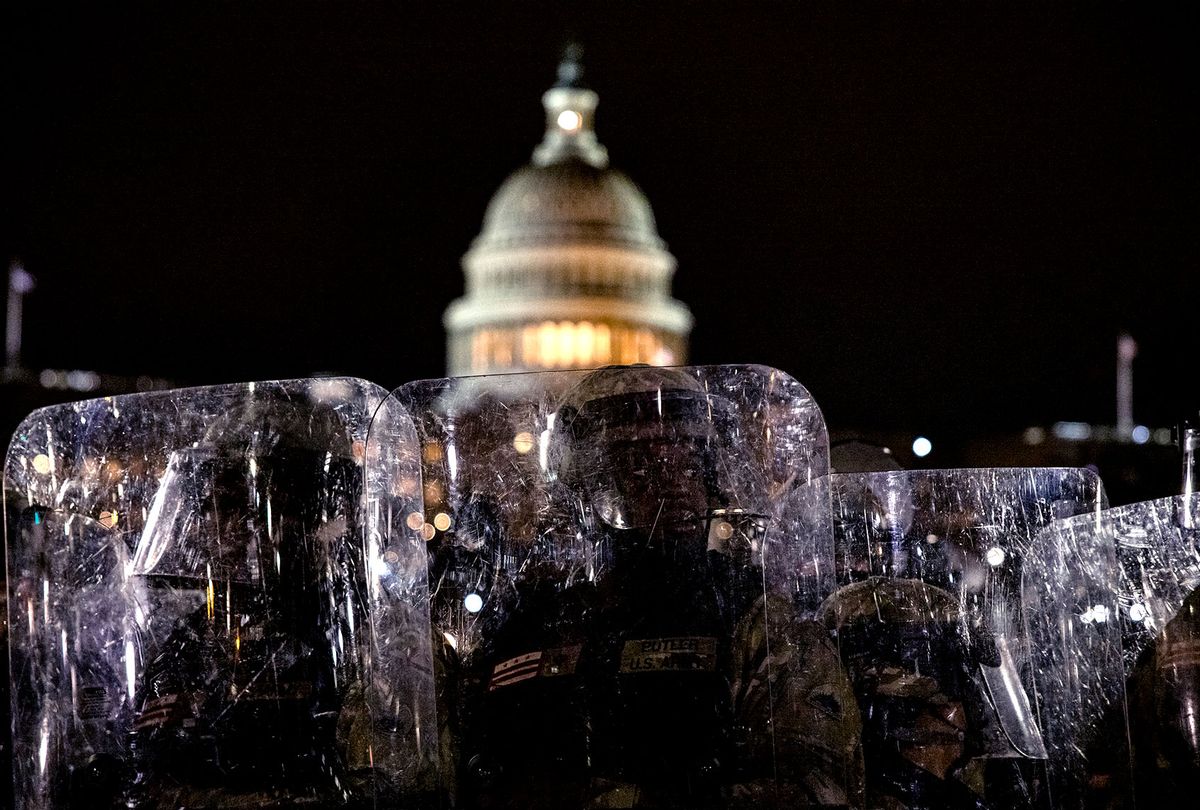 Members of the National Guard and the Washington D.C. police stand guard to keep demonstrators away from the U.S. Capitol on January 06, 2021 in Washington, DC. A pro-Trump mob stormed the Capitol earlier, breaking windows and clashing with police officers. Trump supporters gathered in the nation's capital to protest the ratification of President-elect Joe Biden's Electoral College victory over President Donald Trump in the 2020 election. (Samuel Corum/Getty Images)