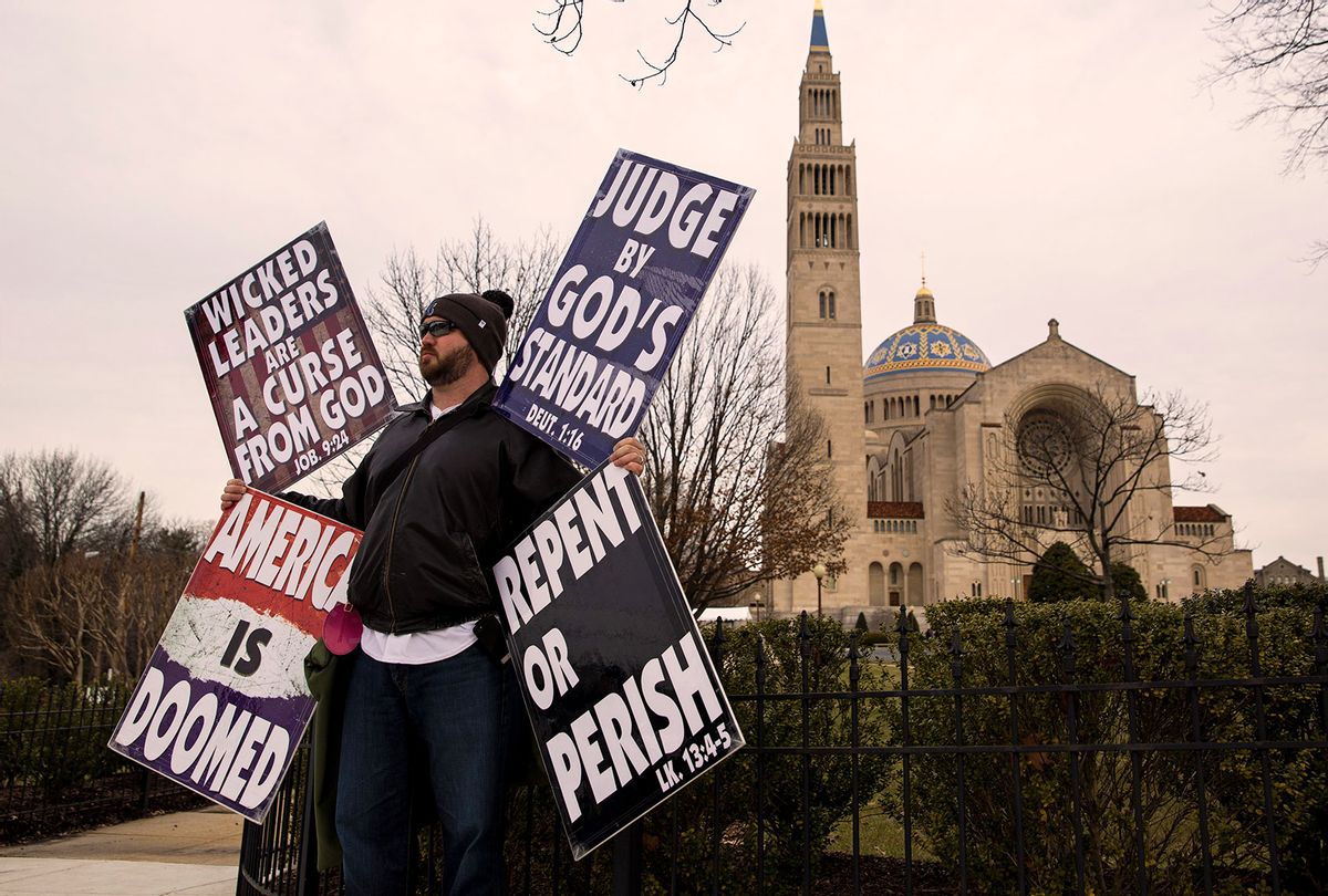 Samuel Phelps-Roper, a member of the Westboro Baptist Church, protests outside of the Basilica of the National Shrine of the Immaculate Conception (Drew Angerer/Getty Images)