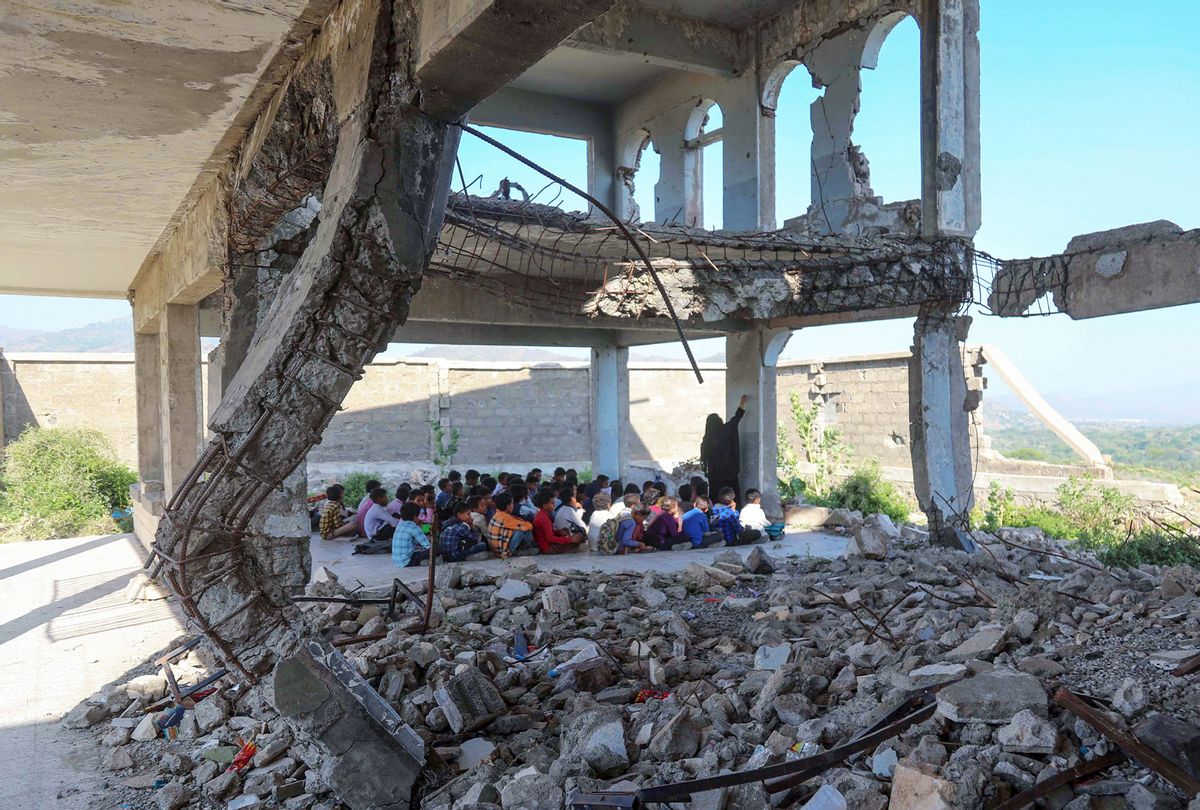 Yemeni pupils attend class on the first day of the new academic year, in a makeshift classroom in their school compound which was heavily damaged in the fighting between the government and Iran-backed Huthi rebels, in the country's third-city of Taez on October 7, 2020. (AHMAD AL-BASHA/AFP via Getty Images)