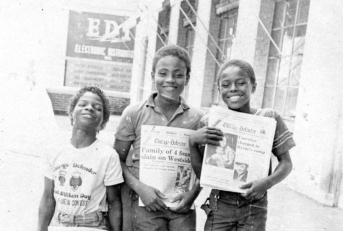 Julius Vance, Laville Williams, and Allen Ware stand and smile while selling the Chicago Defender, the leading African American newspaper in 1982 (The Abbott Sengstacke Family Papers/Robert Abbott Sengstacke/Getty Images)