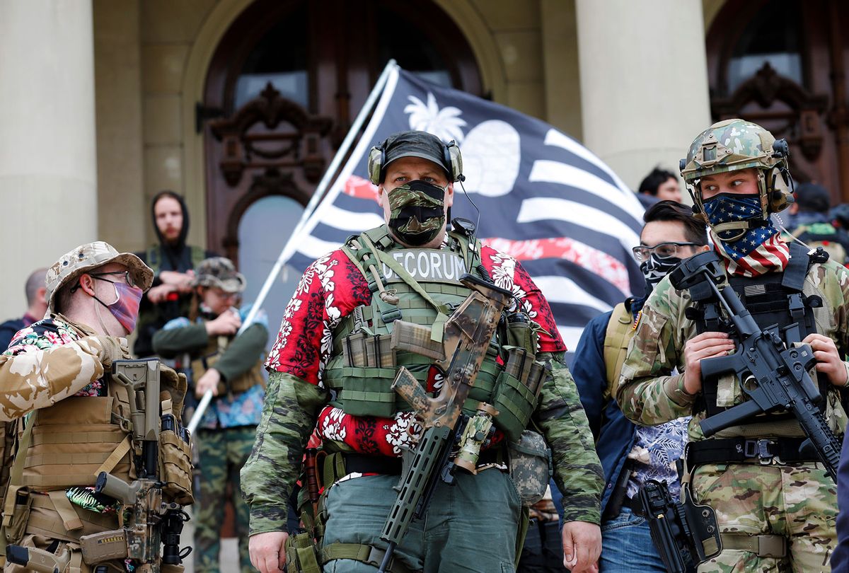 A group tied to the Boogaloo Bois holds a rally at the Michigan State Capitol in Lansing, Michigan on October 17, 2020. (JEFF KOWALSKY/AFP via Getty Images)