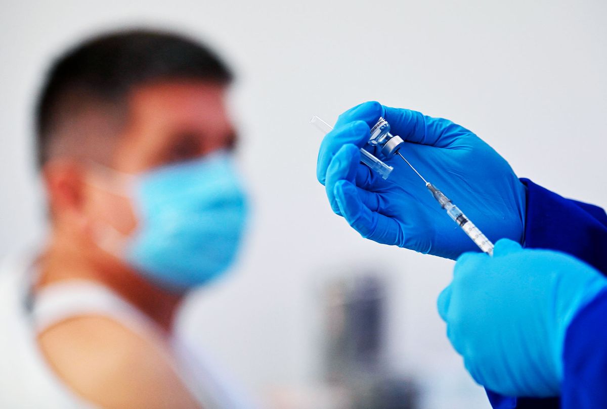 A health worker prepares a dose of the Pfizer-BioNTech vaccine against COVID-19 at the Versalles Clinic, in Cali, Colombia, amid the novel coronavirus pandemic on February 19, 2021. (LUIS ROBAYO/AFP via Getty Images)