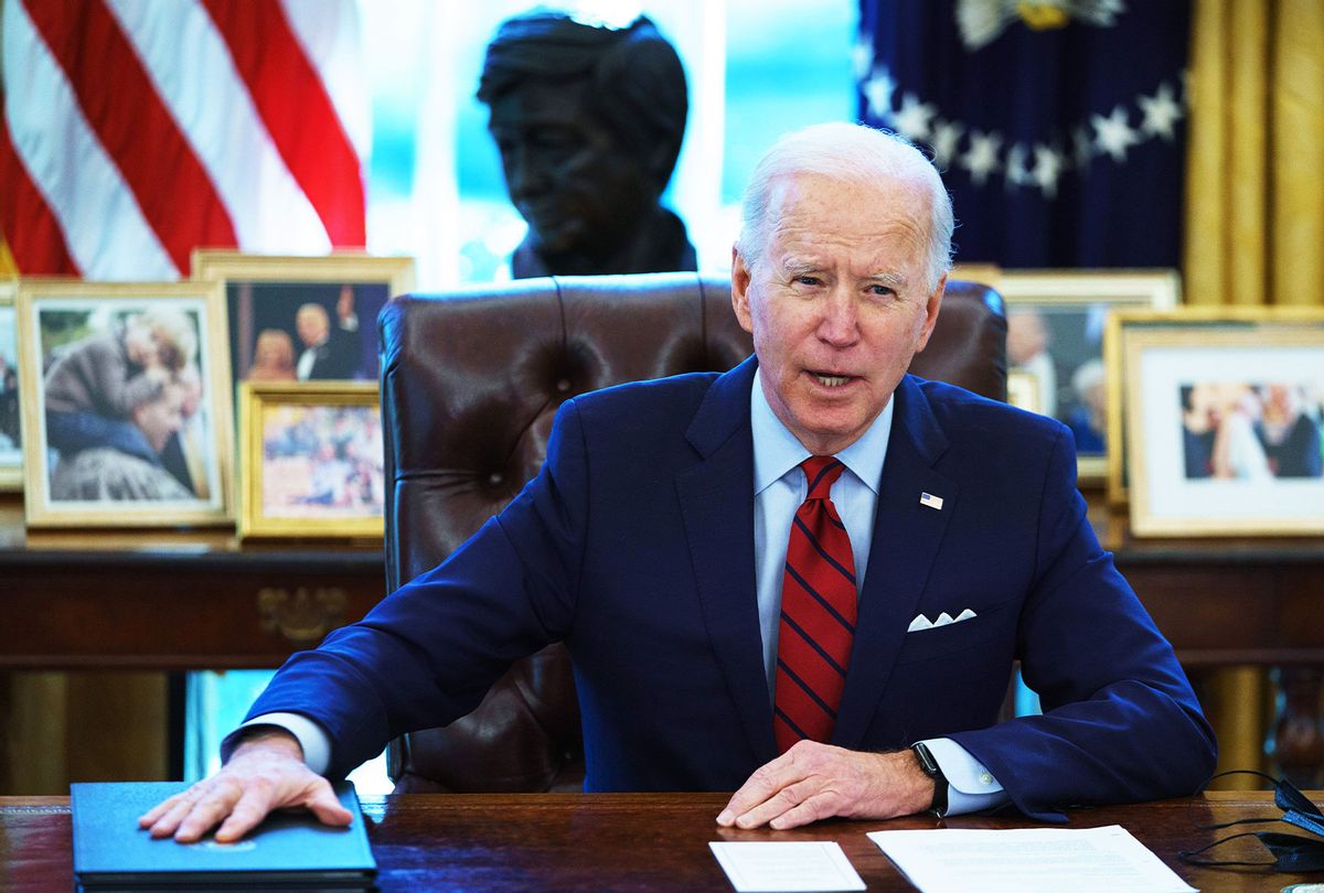 US President Joe Biden speaks before signing executive orders on health care, in the Oval Office of the White House in Washington, DC, on January 28, 2021. (MANDEL NGAN/AFP via Getty Images)