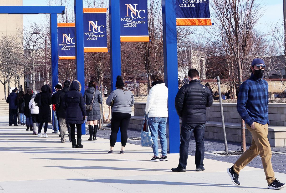 People line up for COVID-19 vaccinations at Nassau Community College on January 10, 2021 in Garden City, New York. Nassau County now has two vaccine centers as another 3.2 million New Yorkers become eligible for the vaccine (Bruce Bennett/Getty Images)
