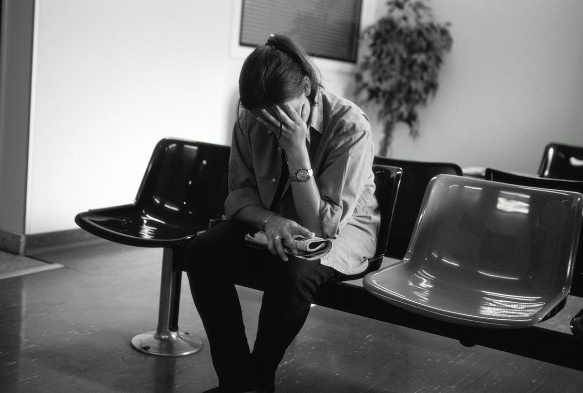 Sad woman in hospital waiting room (Getty Images)