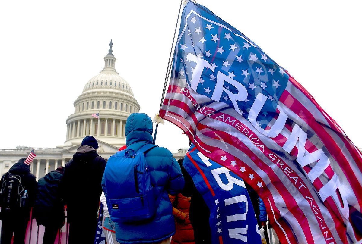 Supporters of US President Donald Trump hold a rally outside the US Capitol as they protest the upcoming electoral college certification of Joe Biden as US President in Washington, DC on January 6, 2021. (OLIVIER DOULIERY/AFP via Getty Images)