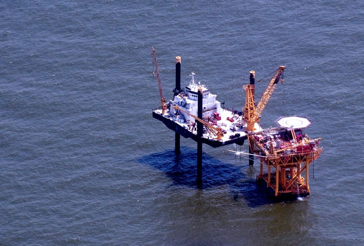 An offshore oil rig sits in the Gulf of Mexico near Grand Isle, Louisiana, June 12, 2010, as cleanup continues on the BP Deepwater Horizon oil spill. (SAUL LOEB/AFP via Getty Images)