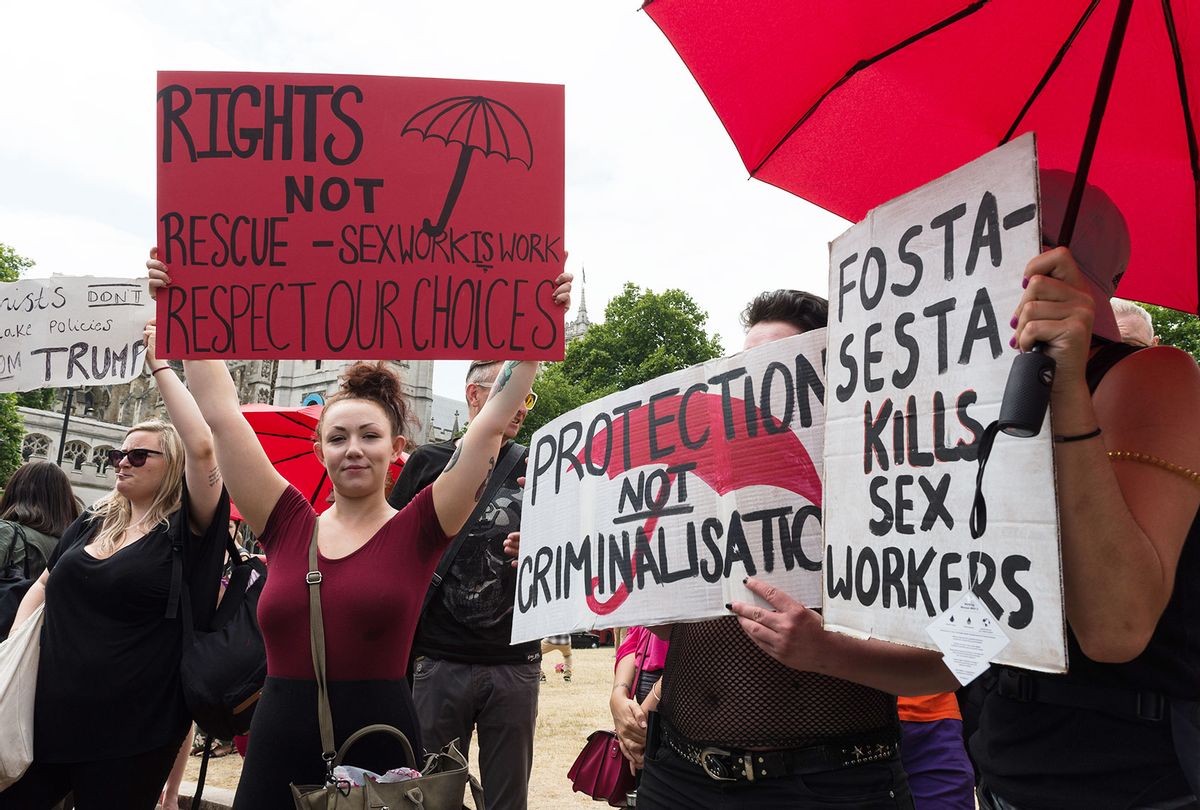 Sex workers and activists stage a protest outside Parliament in London as MPs debate a proposal to outlaw online prostitution platforms. The members of a cross-party group on prostitution argue that UK should follow the recent FOSTA-SESTA legislation in the US, which makes sex work advertising websites directly accountable for encouraging exploitation and trafficking. The protesters say that such legislation will make sex work more dangerous by forcing it out on the streets and removing access to databases of violent clients. July 04, 2018 in London, England. (Wiktor Szymanowicz / Barcroft Media via Getty Images)