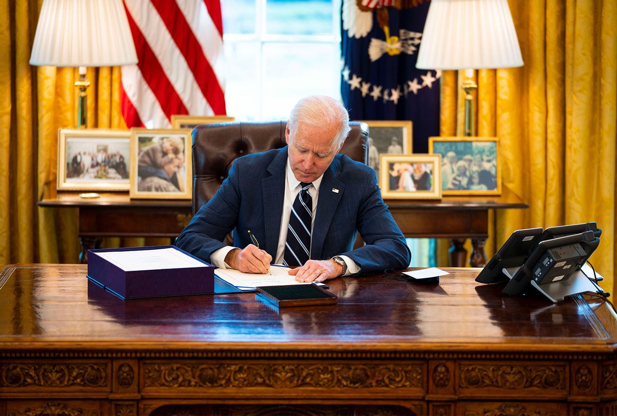 U.S. President Joe Biden participates in a bill signing in the Oval Office of the White House on March 11, 2021 in Washington, DC. President Biden has signed the $1.9 trillion COVID relief bill into law at the event. (Doug Mills-Pool/Getty Images)