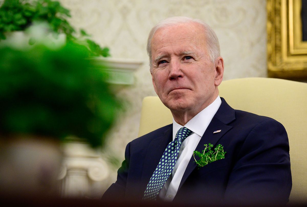 U.S. President Joe Biden listens during a virtual meeting with Irish Prime Minister (Taoiseach) Micheal Martin in the Oval Office of the White House on March 17, 2021 in Washington, DC. Two of Biden's great-great-grandparents emigrated from Ireland. (Erin Scott-Pool/Getty Images)