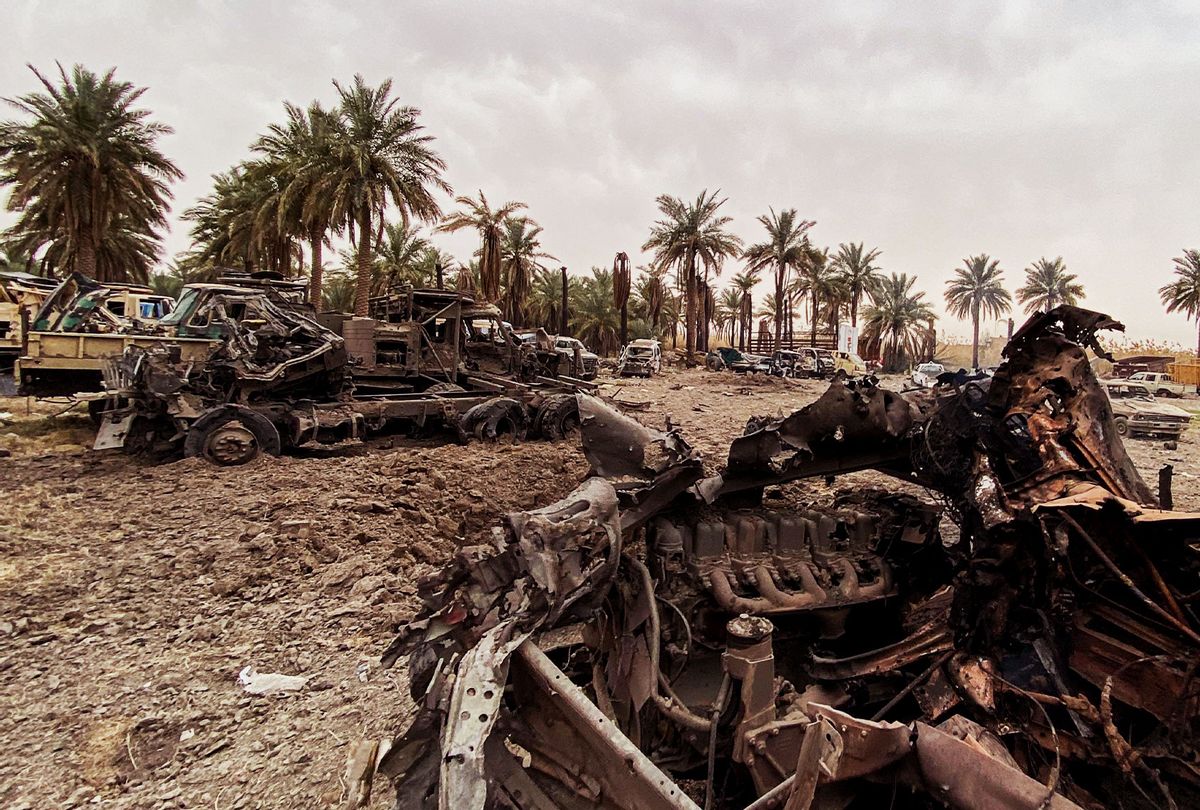 This picture taken on March 13, 2020 shows damaged military vehicles in the aftermath of US military air strikes at a militarised zone in the Jurf al-Sakhr area in Iraq's Babylon province (south of the capital) controlled by Kataeb Hezbollah, a hardline faction of the Hashed al-Shaabi (Popular Mobilisation) forces paramilitaries. (AFP via Getty Images)