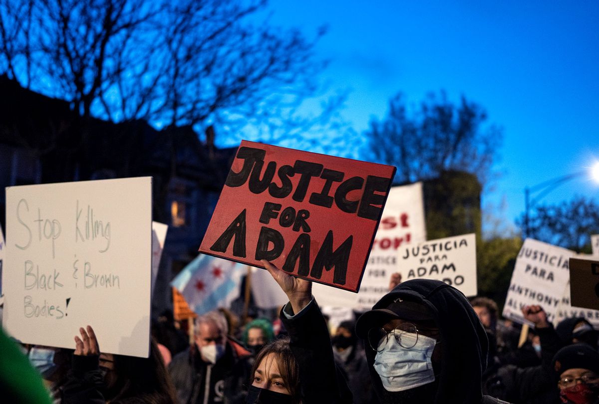 Protesters march through Logan Square neighborhood during a rally on April 16, 2021 in Chicago, Illinois. The rally was held to protest the killing of 13-year-old Adam Toledo by a Chicago Police officer on March 29th. (Max Herman/NurPhoto via Getty Images)