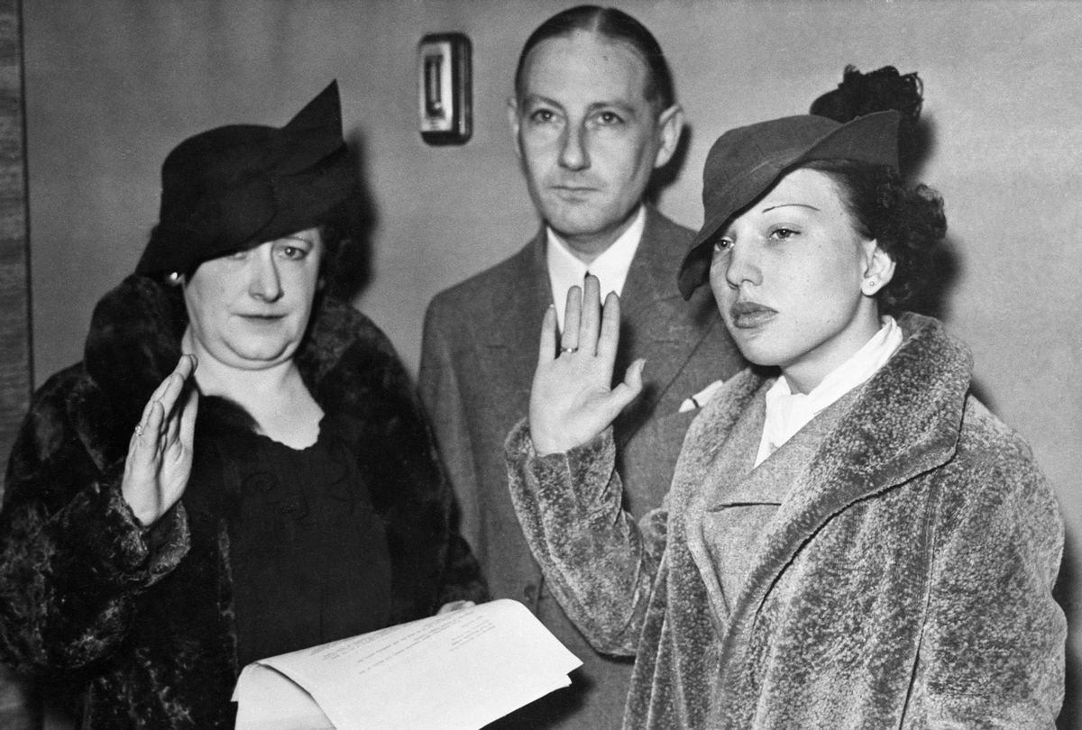 Preparatory to their filing a $500,000 damage suit against the girl's mother, Mrs. Maryon Hewitt McCarter, two California physicians, and a psychiatrist, Miss Ann Cooper Hewitt, (right), and her attorney, Russel P. Tyler, are shown making final depositions. The charges claimed her mother and the doctors conspired to perform an operation rendering her sterile. (Bettmann Archive/Getty Images)