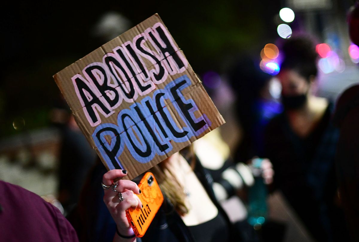 A placard states "ABOLISH POLICE" during a march to protest the death of Daunte Wright on April 13, 2021 in Philadelphia, Pennsylvania. People have taken to the streets to protest after Daunte Wright, a 20-year old black man, was shot and killed by police in Brooklyn Center, Minnesota. (Mark Makela/Getty Images)