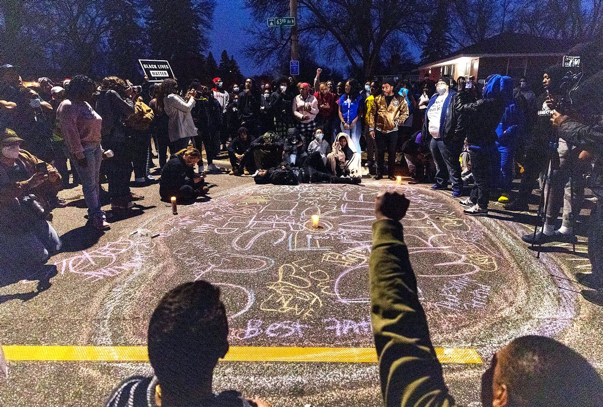 A crowd formed a circle around a memorial for Daunte Wright in Brooklyn Center, Minnesota. (Carlos Gonzalez/Star Tribune via Getty Images)