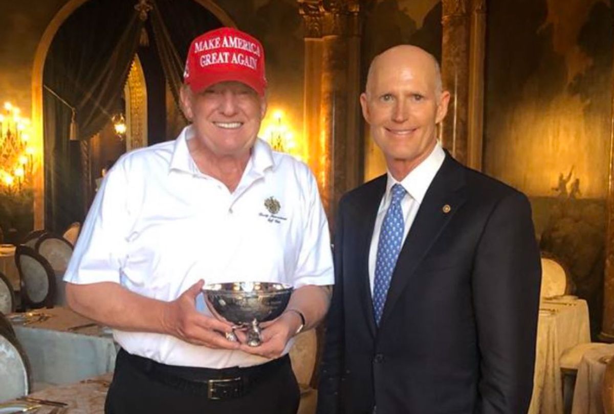 Sen. Rick Scott presents President Donald Trump with a tiny ceremonial bowl (NRSC)