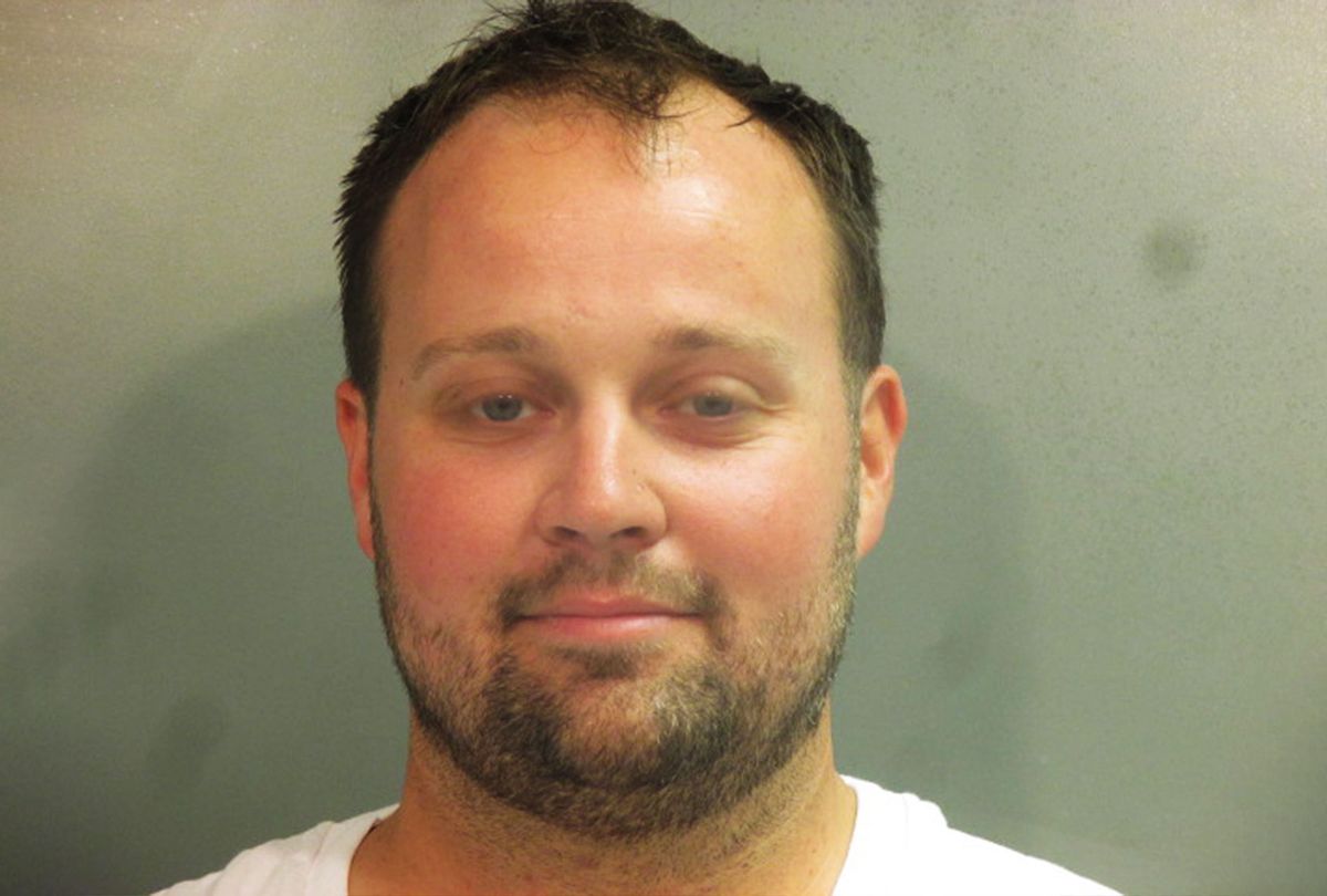 In this handout photo provided by the Washington County Sheriff’s Office, former television personality on "19 Kids And Counting" Josh Duggar poses for a booking photo after his arrest April 29, 2021 in Fayetteville, Arkansas. Duggar was reportedly arrested by federal agents and is being detained on a federal hold. (Washington County Sheriff’s Office via Getty Images)