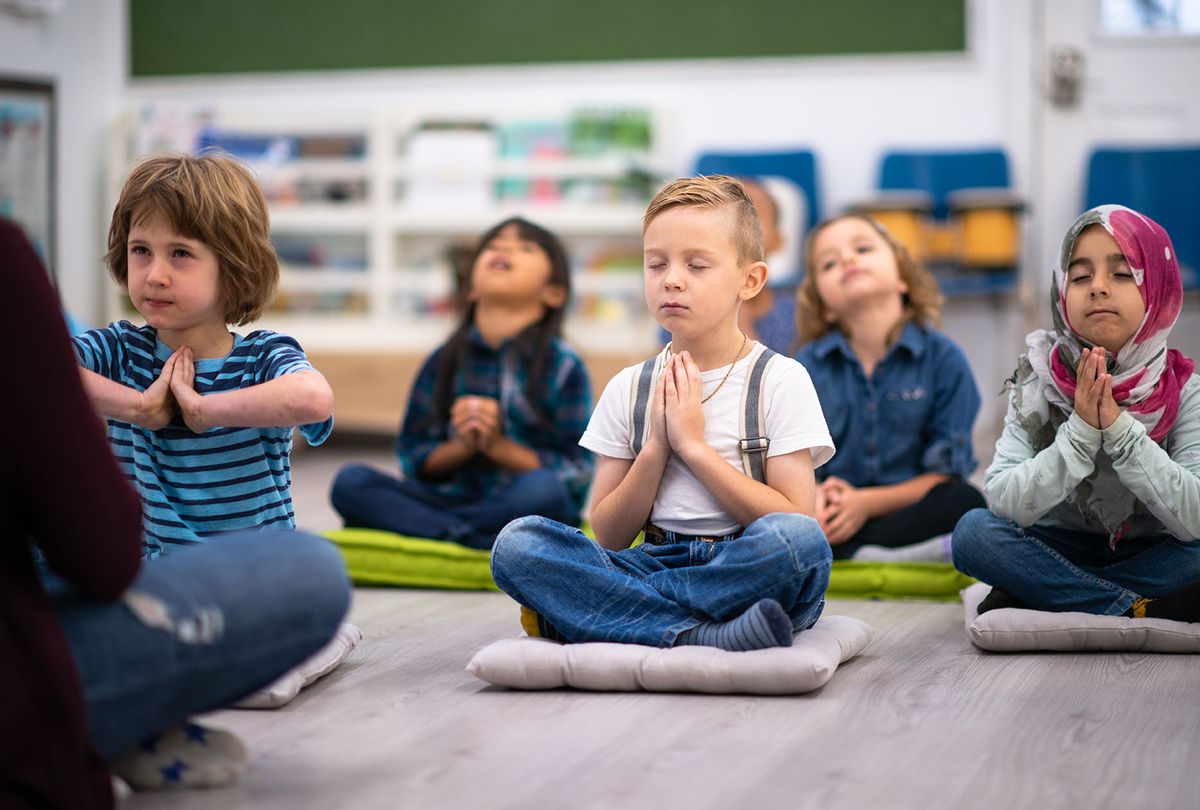 Kids having a yoga class (Getty Images)