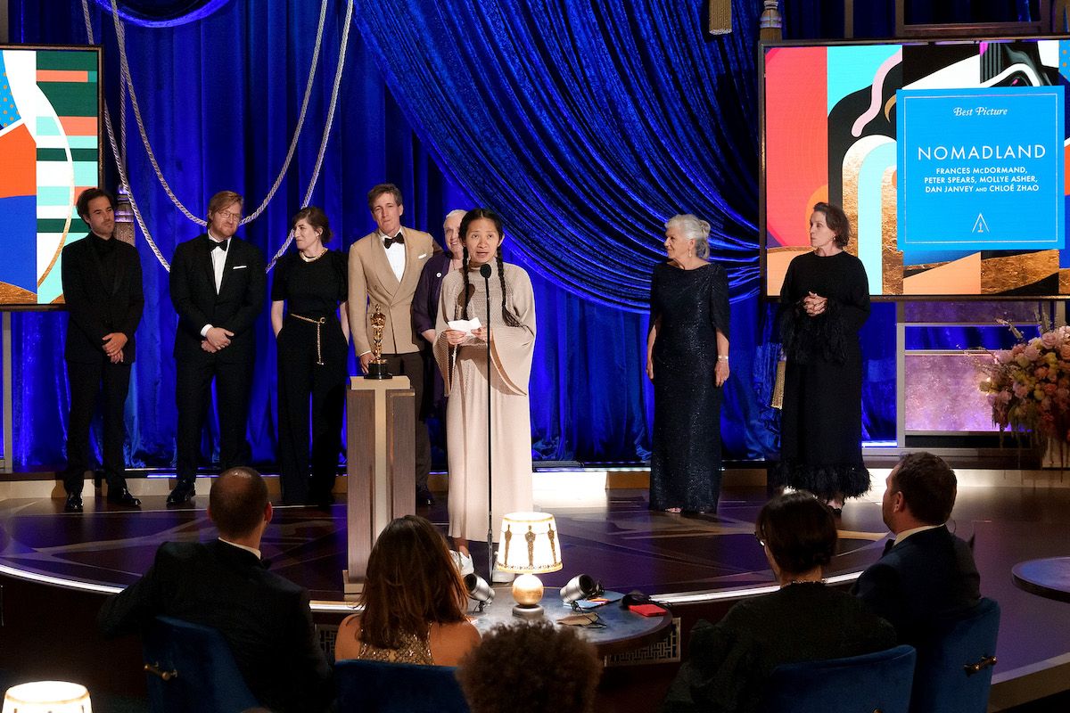 In this handout photo provided by A.M.P.A.S., (L-R) Joshua James Richards, Dan Janvey, Mollye Asher, Peter Spears, Charlene Swankie, Chloé Zhao, Linda May, and Frances McDormand accept the Best Picture award for "Nomadland" onstage during the 93rd Annual Academy Awards at Union Station on April 25, 2021 in Los Angeles, California. (Todd Wawrychuk/A.M.P.A.S. via Getty Images)