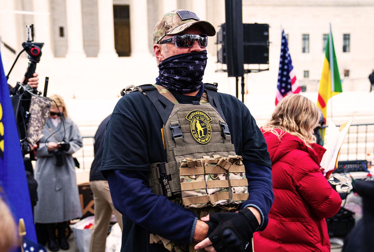 A member of the right-wing group Oath Keepers stands guard during a rally in front of the U.S. Supreme Court Building on January 5, 2021 in Washington, DC. Today's rally kicks off two days of pro-Trump events fueled by President Trump's continued claims of election fraud and a last-ditch effort to overturn the results before Congress finalizes them on January 6. (Robert Nickelsberg/Getty Images)