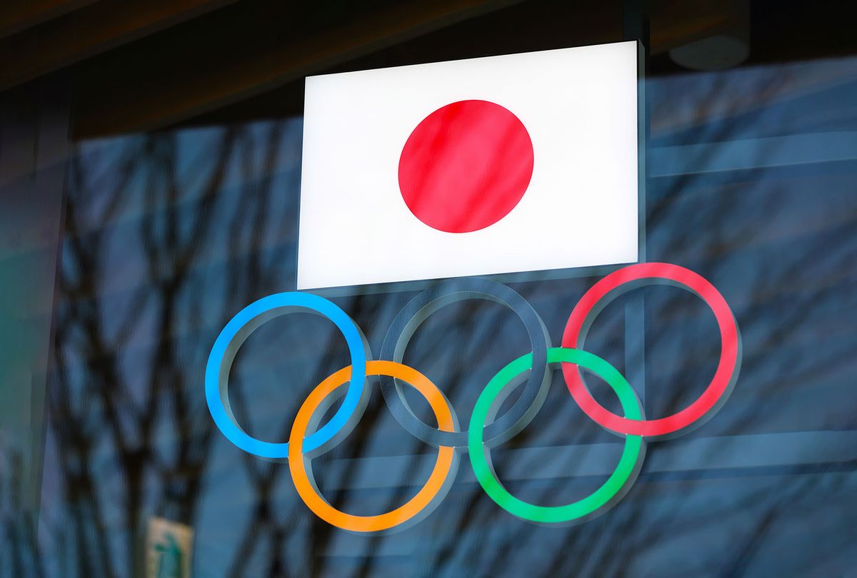 Japanese flag with Olympic Rings above the entrance to Japan Olympic Museum in Shinjuku. Due to the Coronavirus pandemic, the Tokyo 2020 Olympic Games were moved to be held between 7.23 - 8.8, 2021. (Stanislav Kogiku/SOPA Images/LightRocket via Getty Images)