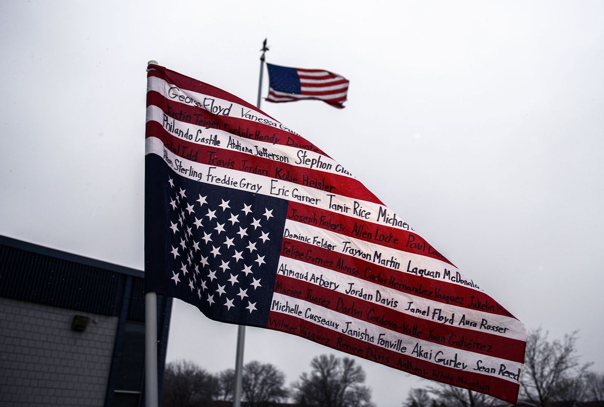 An upside-down American flag bearing the names of people killed by police is displayed during a protest on April 13, 2021 in Brooklyn Center, Minnesota.  (Stephen Maturen/Getty Images)