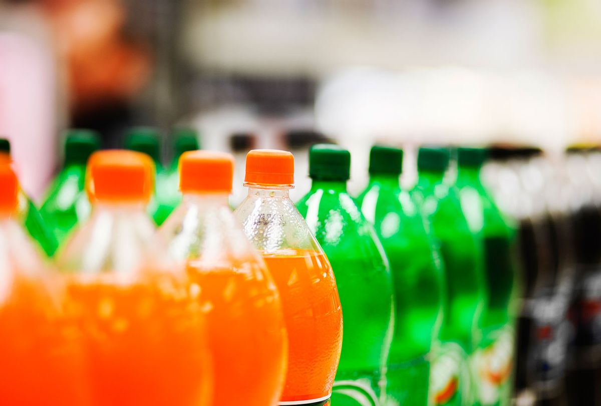 A long line of soda bottles in various flavors and colors (Getty Images)