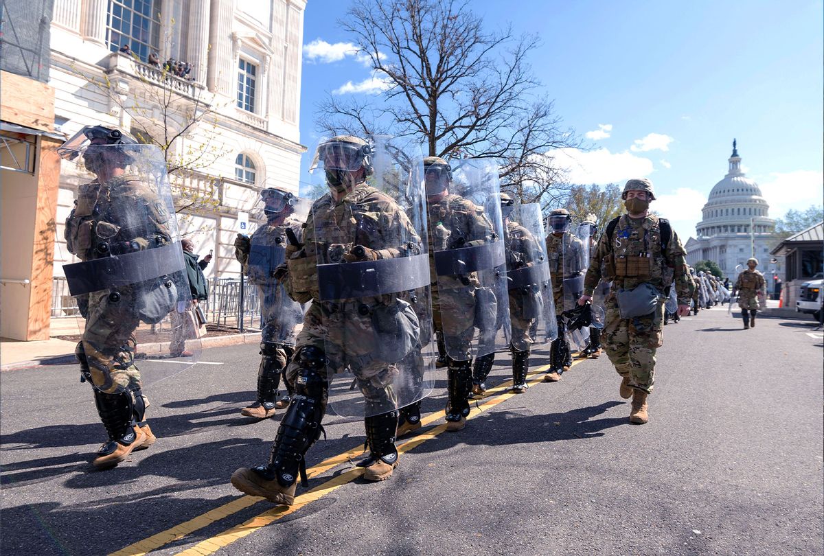 National Guard troops in riot gear leave the scene as Capitol Police investigate the scene after a vehicle drove into a security barrier near the U.S. Capitol building on Friday April 2, 2021. (Bill Clark/CQ-Roll Call, Inc via Getty Images)