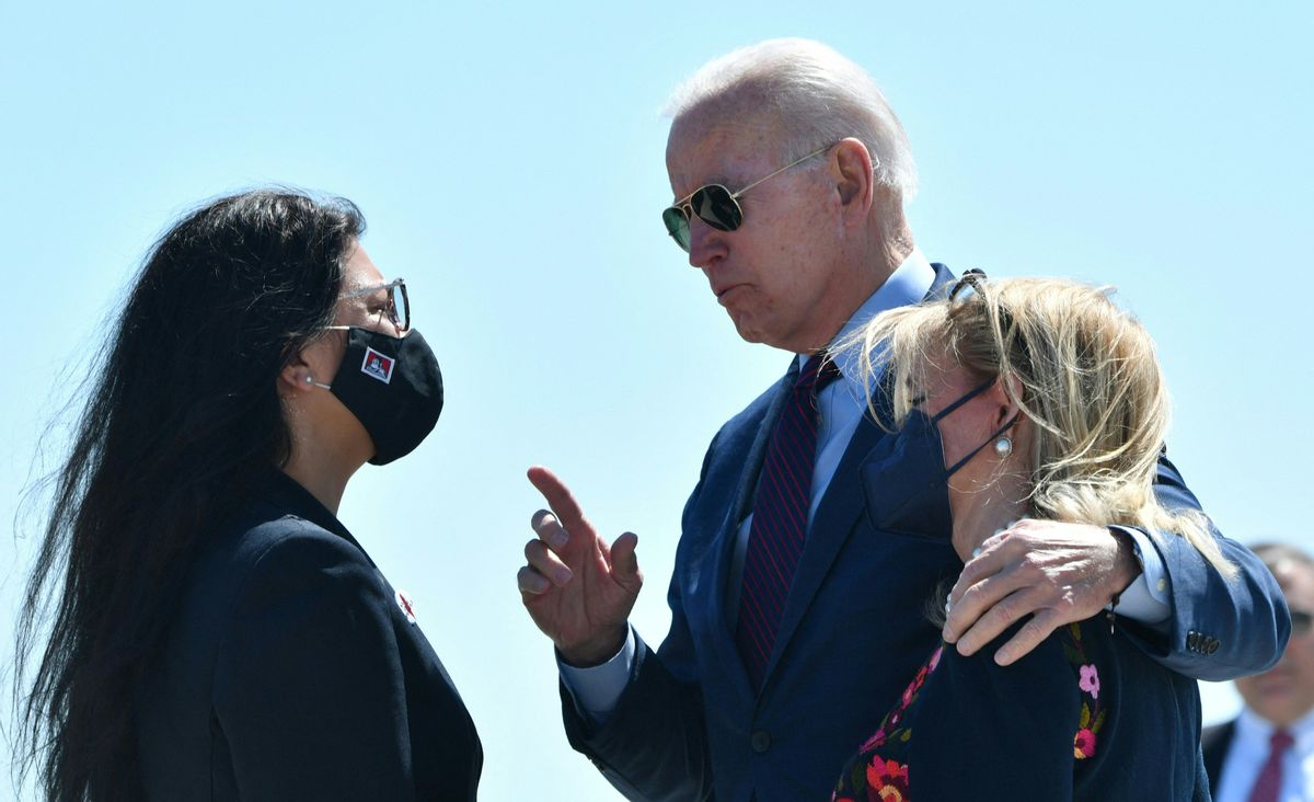 President Joe Biden speaks with Representative Rashida Tlaib, D-Mich., and Representative Debbie Dingell, D-Mich., as he arrives in Detroit on May 18, 2021. (Getty Images)