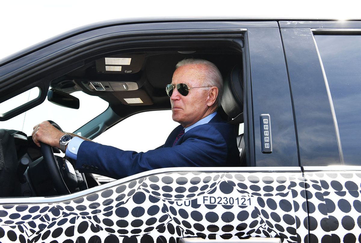 US President Joe Biden drives the new electric Ford F-150 Lightning at the Ford Dearborn Development Center in Dearborn, Michigan on May 18, 2021. (NICHOLAS KAMM/AFP via Getty Images)