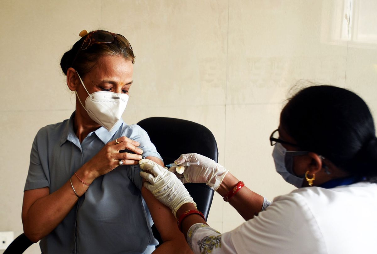 A beneficiary receives a dose of Covid-19 vaccine, at a district hospital, on June 24, 2021 in Noida, India. (Sunil Ghosh/Hindustan Times via Getty Images)