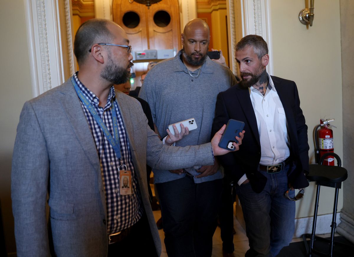 Metropolitan Police Officer Michael Fanone (R) answers questions while leaving the office of House Minority Leader Kevin McCarthy (R-CA), with U.S. Capitol Police Officer Harry Dunn (C) at the U.S. Capitol on June 25, 2021. (Win McNamee/Getty Images)