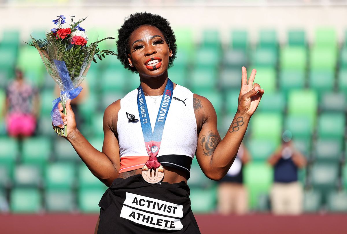 Gwendolyn Berry displays an Activist Athlete shirt as she celebrates finishing third in the Women's Hammer Throw final on day nine of the 2020 U.S. Olympic Track & Field Team Trials at Hayward Field on June 26, 2021 in Eugene, Oregon. (Patrick Smith/Getty Images)