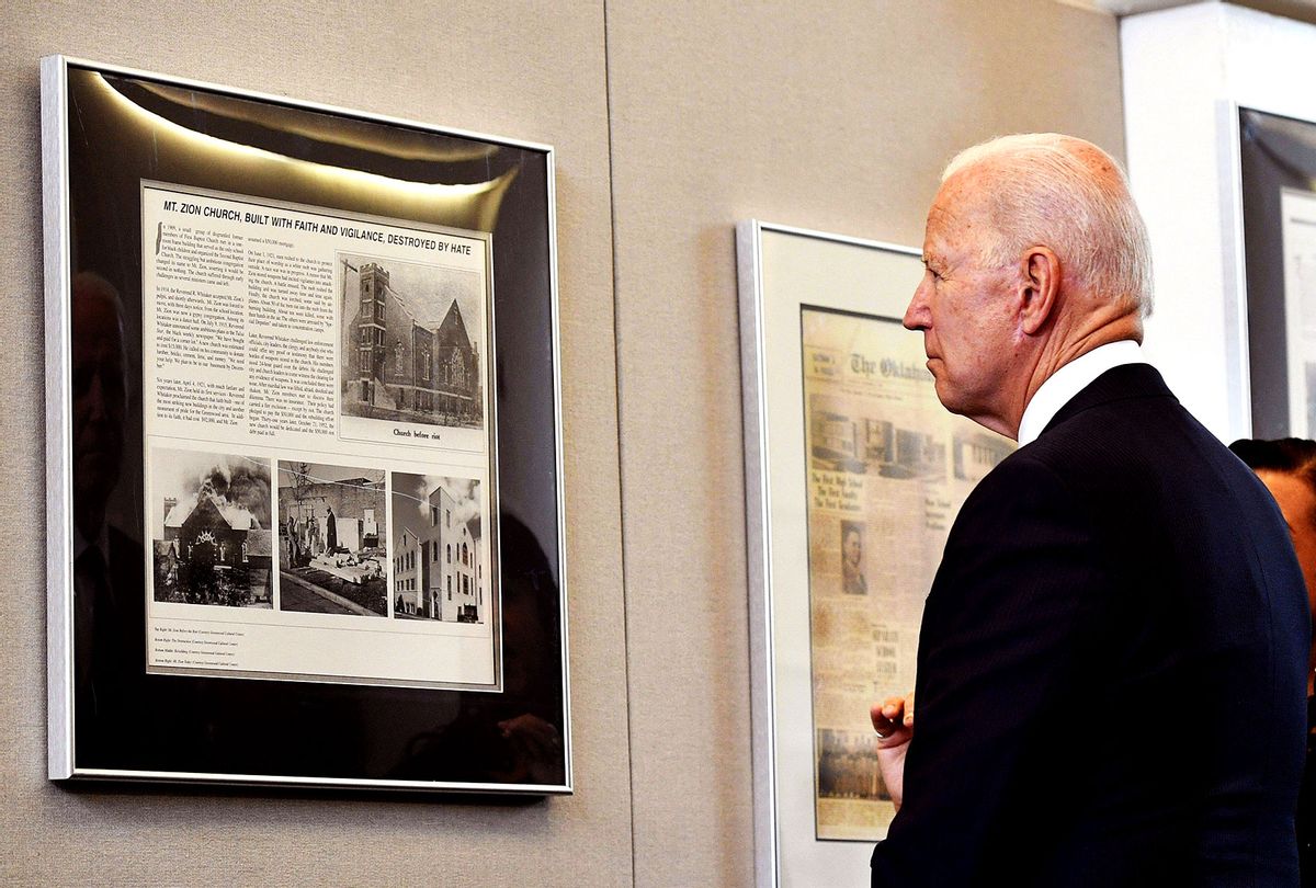 US President Joe Biden tours the Greenwood Cultural Center in Tulsa, Oklahoma on June 1, 2021. - US President Joe Biden traveled Tuesday to Oklahoma to honor the victims of a 1921 racial massacre in the city of Tulsa, where African American residents are hoping he will hear their call for financial reparations 100 years on. (MANDEL NGAN/AFP via Getty Images)