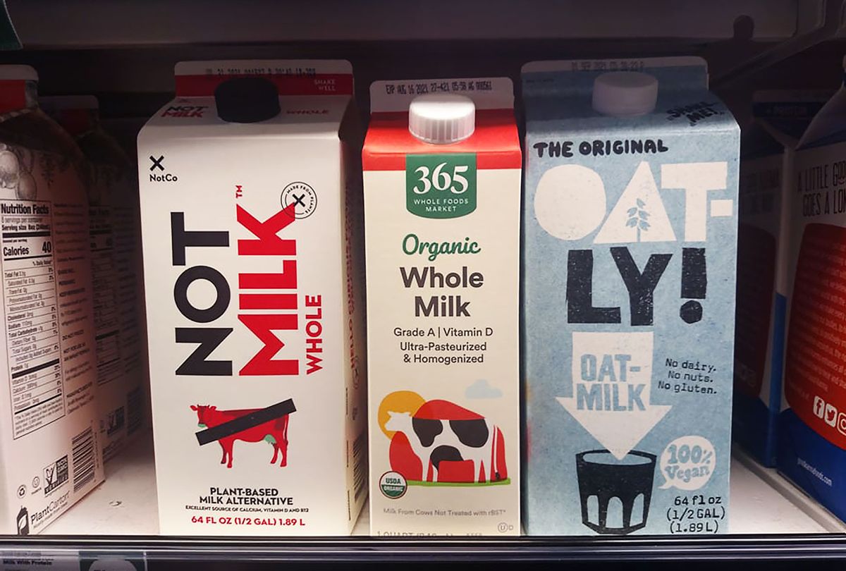 NotMilk, Whole Milk and Oat Milk on a Whole Foods shelf (Ashlie Stevens)