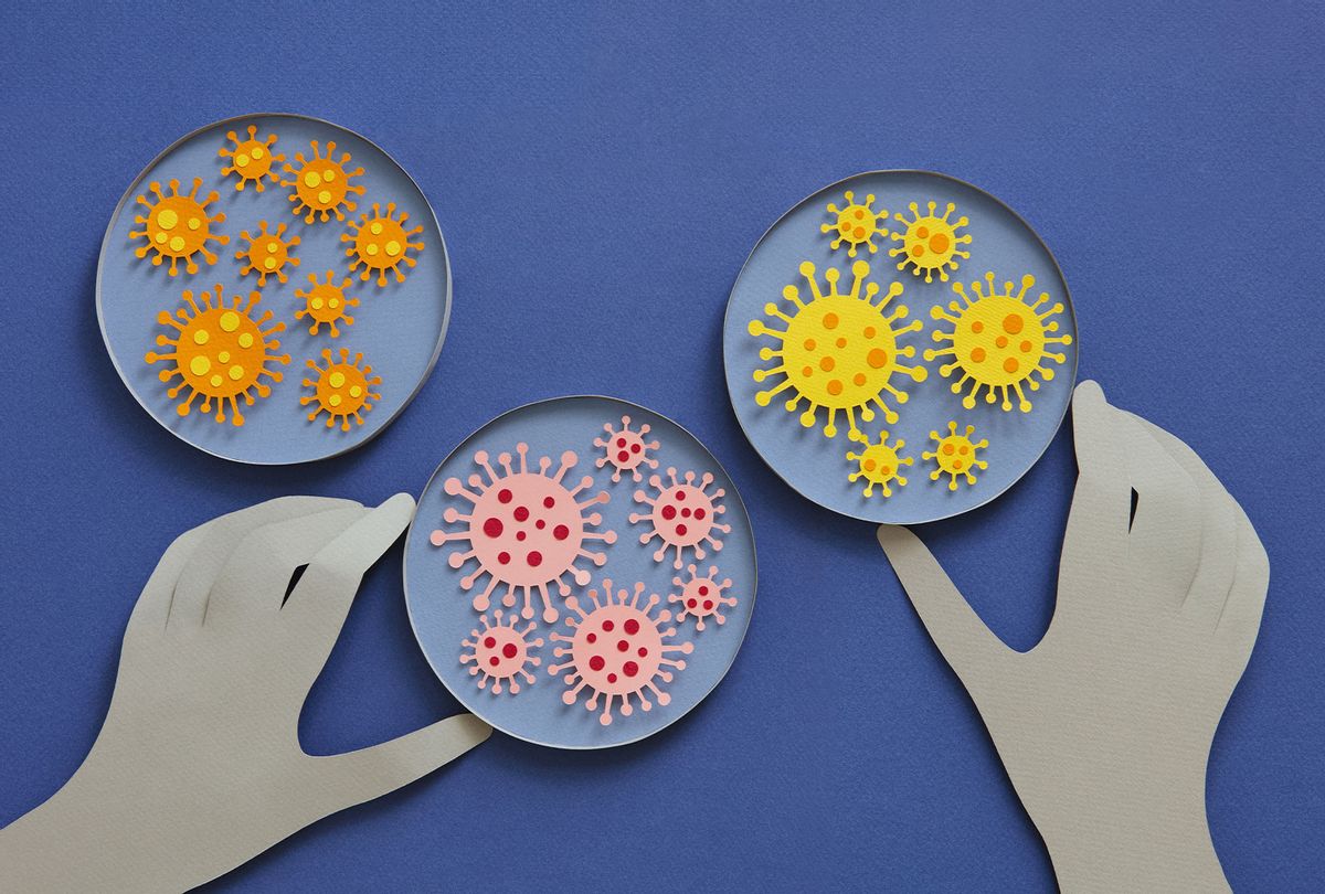 Paper illustration of human hands and coronavirus in a lab (Getty Images)