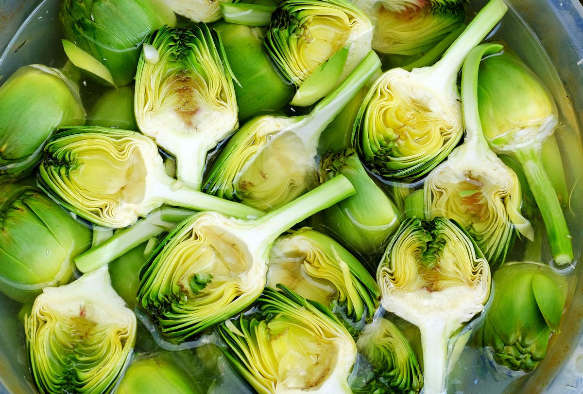 Artichokes sold cut in half and soaked in water (Emreturan Photo/Getty Images)