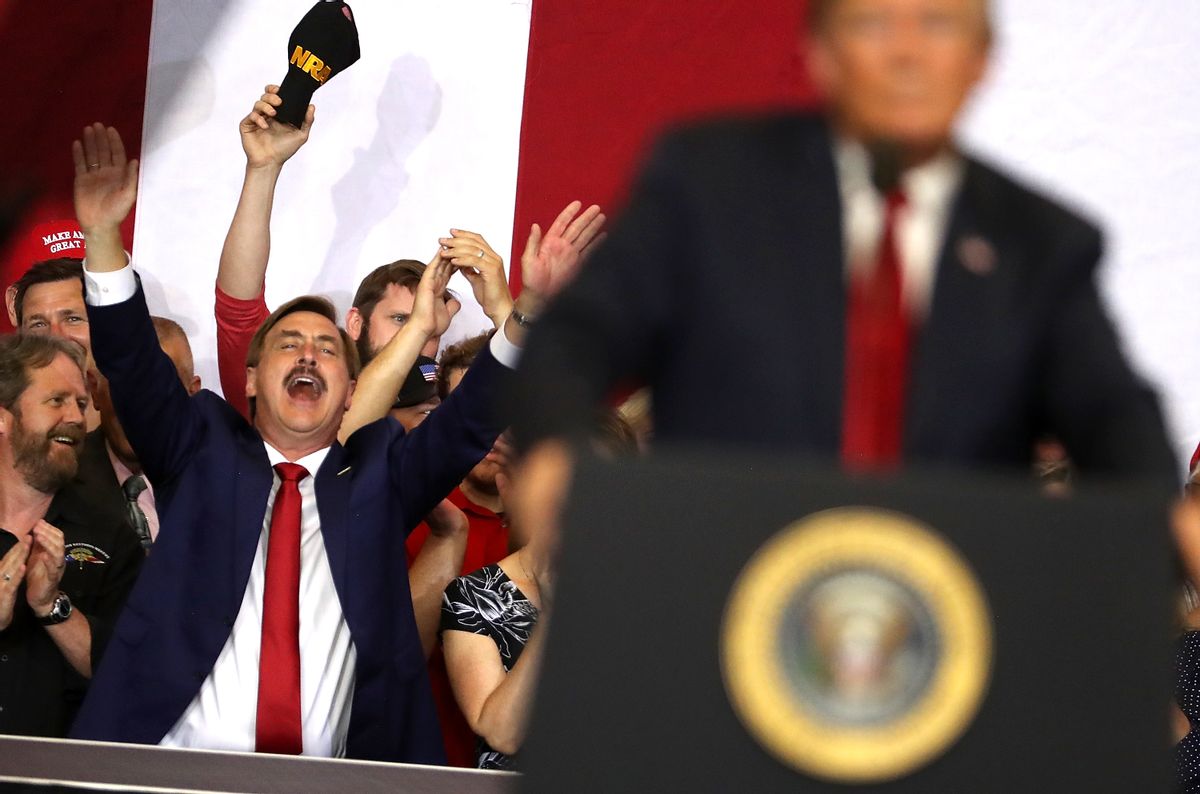 MyPillow CEO Mike Lindell cheers as then-President Donald Trump speaks to supporters during a campaign rally. (Justin Sullivan/Getty Images)