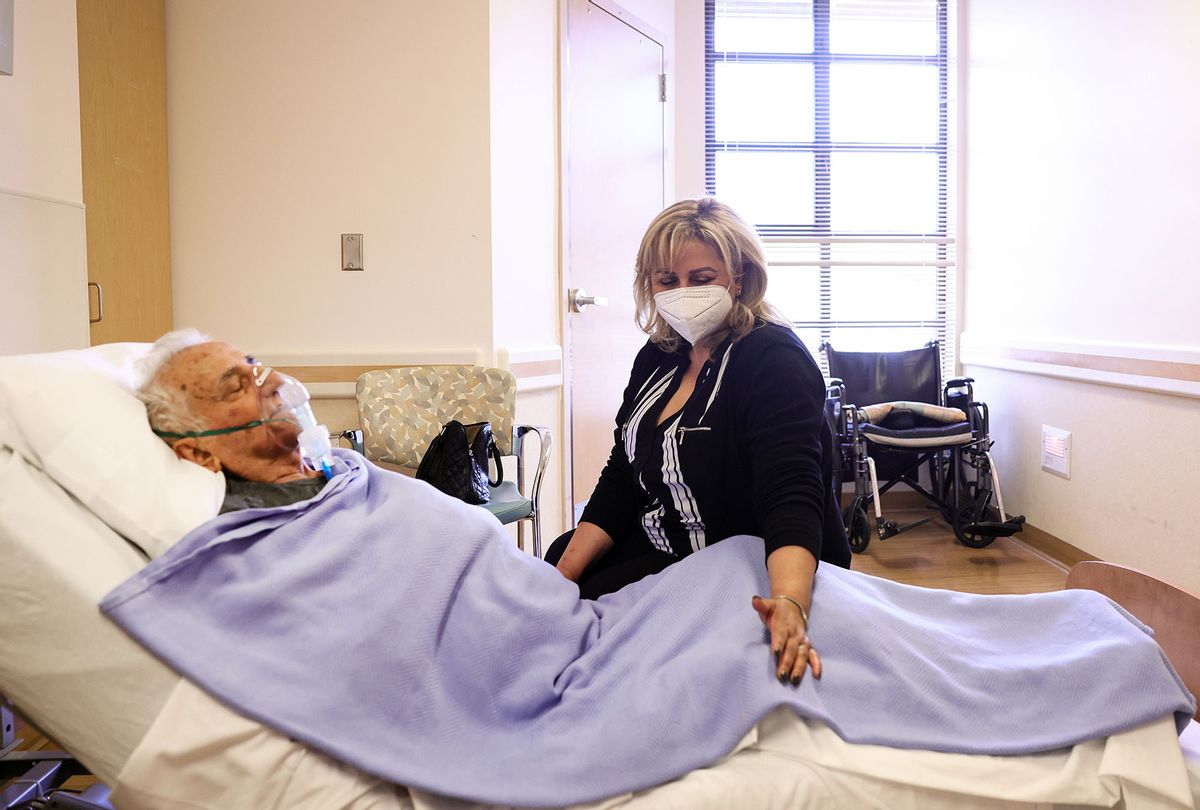 Nursing home resident is visited by their daughter, wearing face mask (Mario Tama/Getty Images)