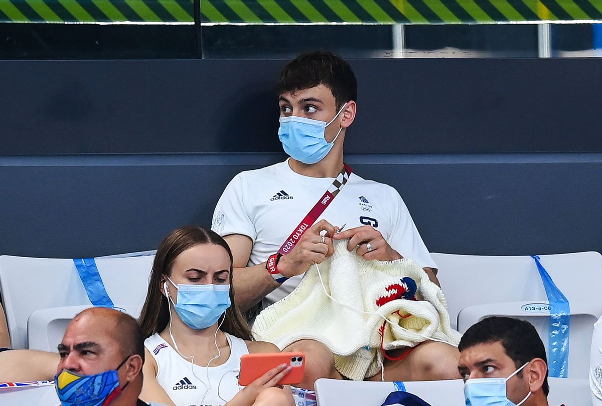 Tom Daley of Great Britain knits during the preliminary round of the men's 3m springboard at the Tokyo Aquatics Centre on day ten of the 2020 Tokyo Summer Olympic Games in Tokyo, Japan. (Stephen McCarthy/Sportsfile via Getty Images)