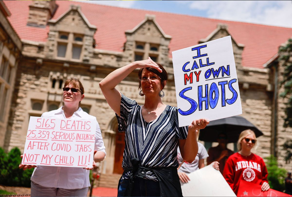 Anti-vaxxers and anti-maskers gathered at Indiana University's Sample Gates to protest against mandatory Covid vaccinations IU is requiring for students, staff and faculty during the upcoming fall semester. (Jeremy Hogan/SOPA Images/LightRocket via Getty Images)