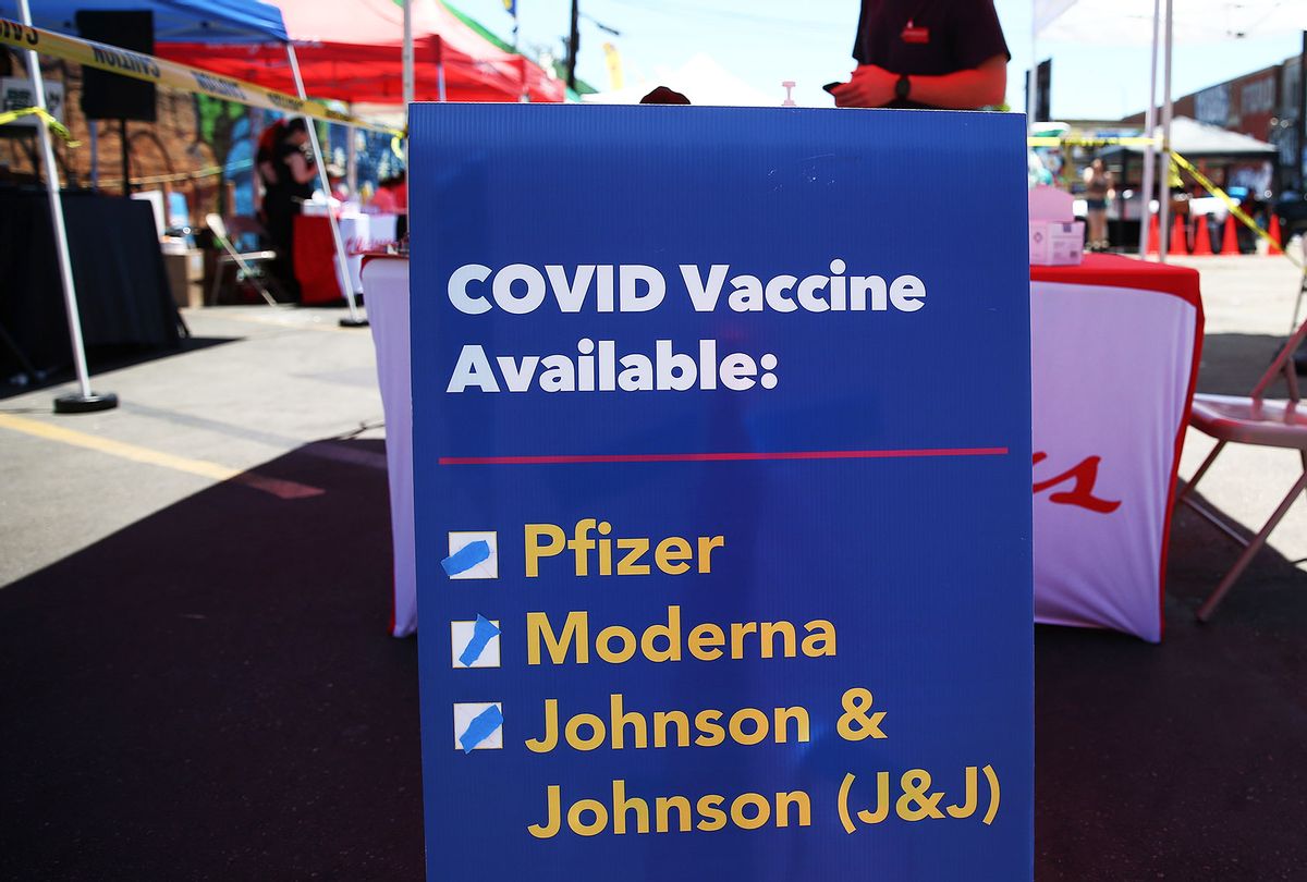 A sign displays the types of COVID-19 vaccination doses available at a Walgreens mobile bus clinic on June 25, 2021 in Los Angeles, California. The United States will miss President Joe Biden's goal of delivering at least one coronavirus vaccine dose to 70 percent of adults by the July 4th holiday. (Mario Tama/Getty Images)