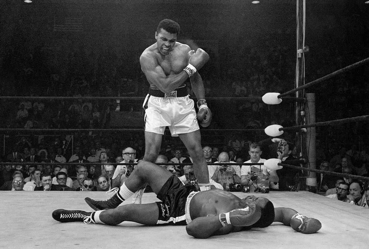 Muhammad Ali stands over fallen Sonny Liston, shouting and gesturing shortly after dropping Liston with a short hard right to the jaw in Lewiston, Maine. May 25, 1965 (John Rooney/AP Images via PBS)