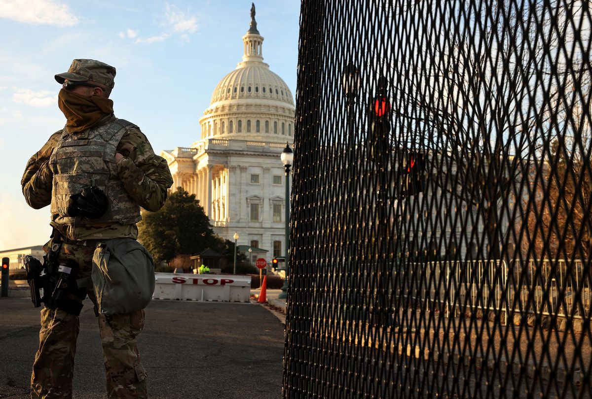 A member of the New York National Guard stands at a gate outside the U.S. Capitol in Washington, DC. (Chip Somodevilla/Getty Images)